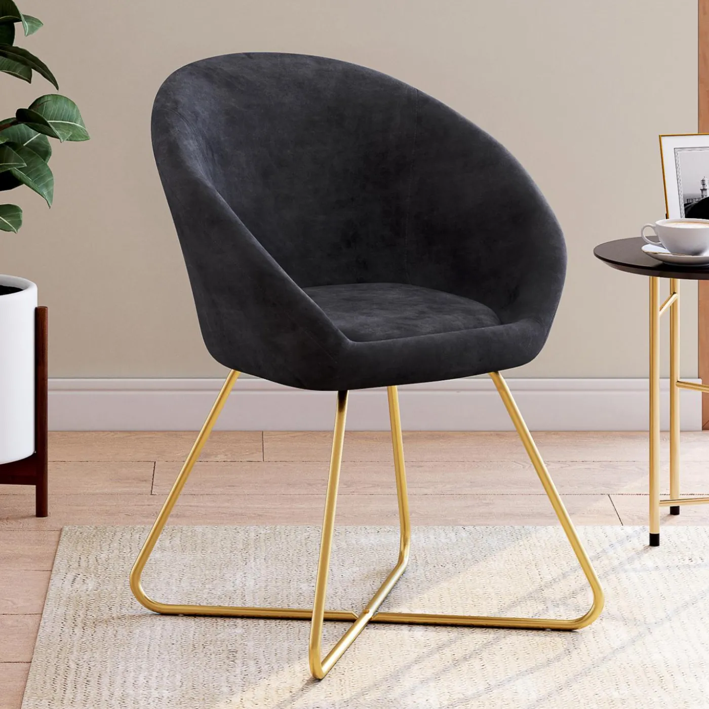 Fauteuil rond en velours gris avec pieds croisés dorés