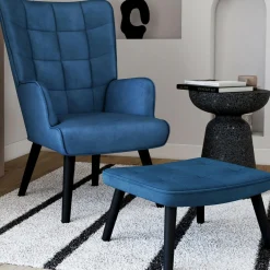 Fauteuil scandinave en velours bleu avec repose-pieds