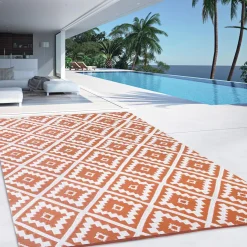 Tapis extérieur terracotta et blanc motifs géométriques 120 x 180 cm